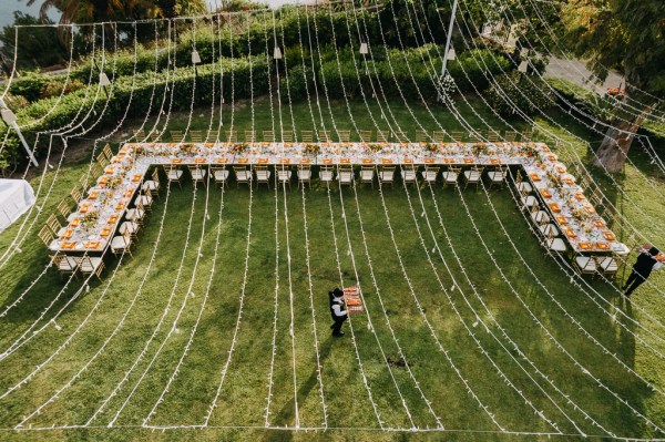 long view of dining room table orange themed wide shot drone view shot