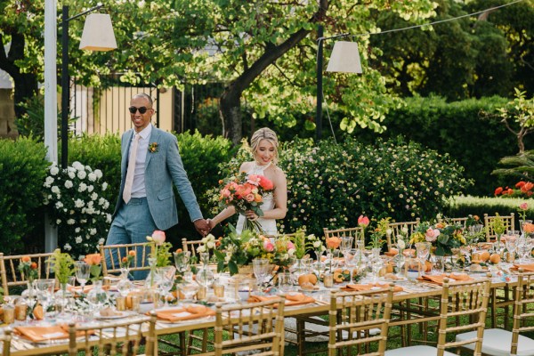 bride and groom stand at the dining room table