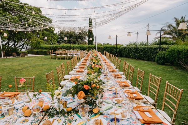 long view of dining room table orange themed