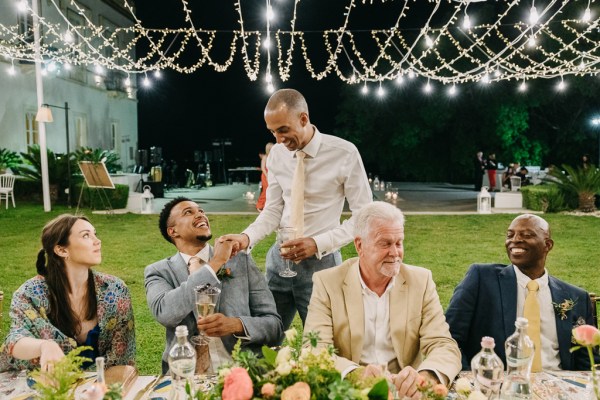 groom and friends greet and smile