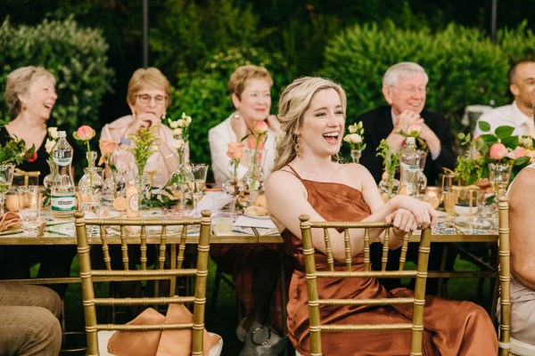 guests laugh at the dining room table