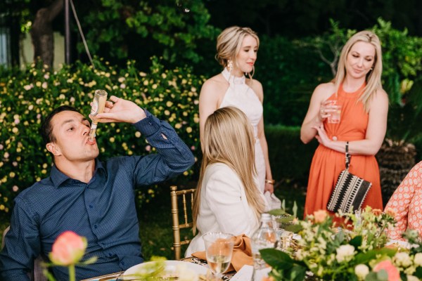 bride friends guests at dining room table