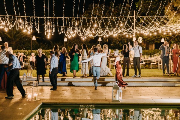 guests dancing beside swimming pool