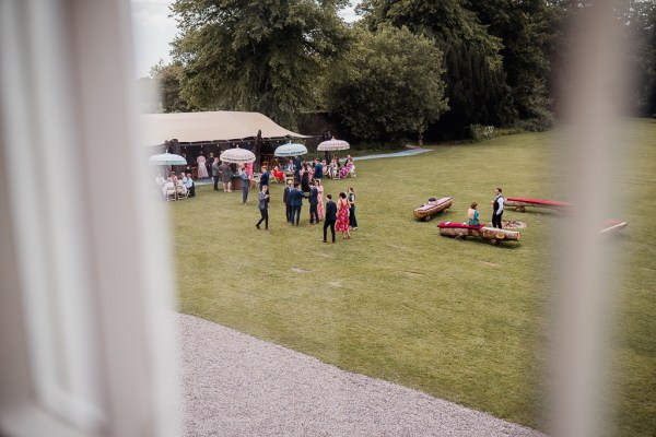 Atmosphere shot from upstairs bedroom window guests and grass