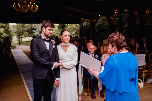 Bride groom and celebrant at alter