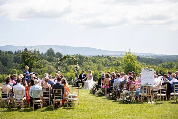 Wide shot of guests seated during ceremony