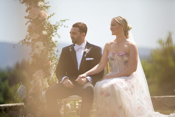 Bride and groom seated during ceremony