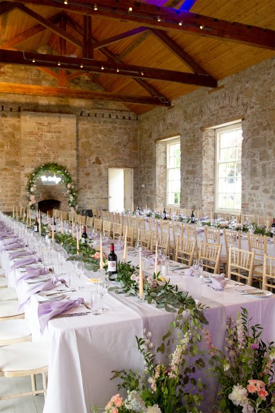 Empty dining room interior ballroom for guests candles and glasses on tables window view