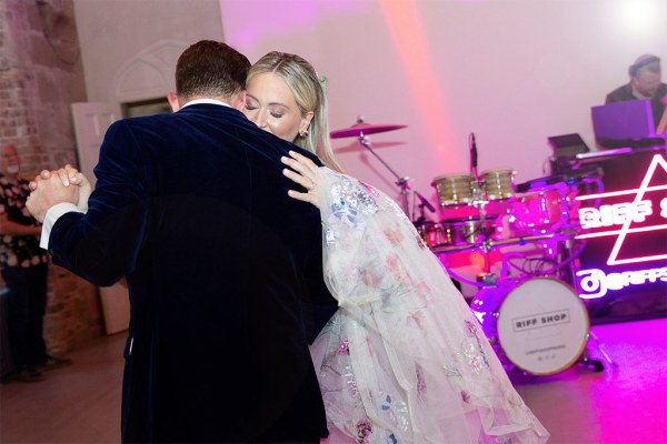 Bride and groom enjoy their first dance on the dancefloor