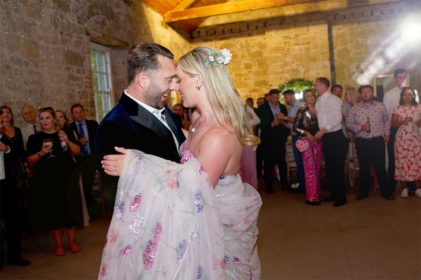 Bride and groom enjoy their first dance on the dancefloor