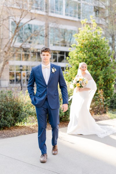 Bride and groom on the pathway to garden