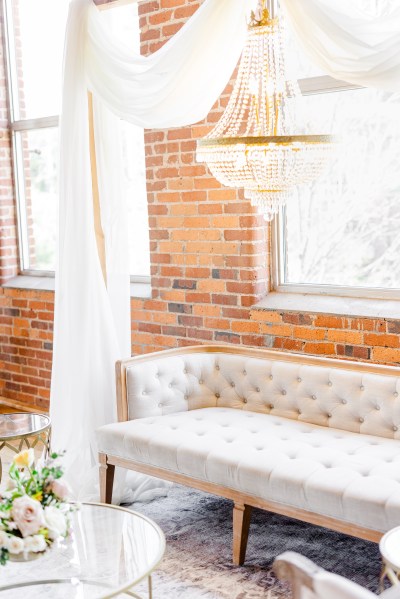 Chandelier hanging in stately manor house interior setting