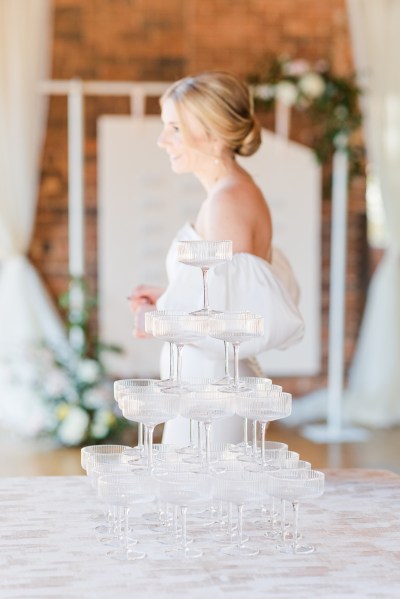 Champagne fountain in view bride standing behind it