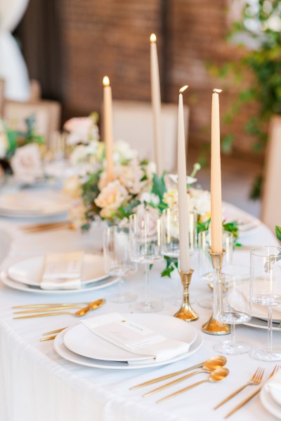 Table setting white pink roses flowers and candles