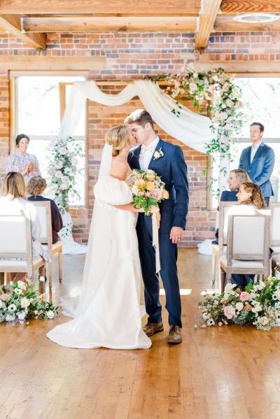 Bride and groom kiss after ceremony