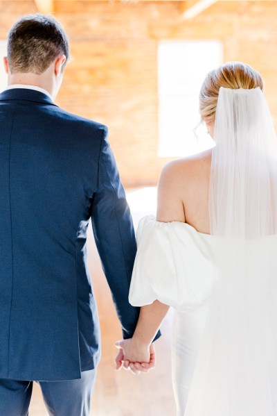 Bride and groom from behind veil detail