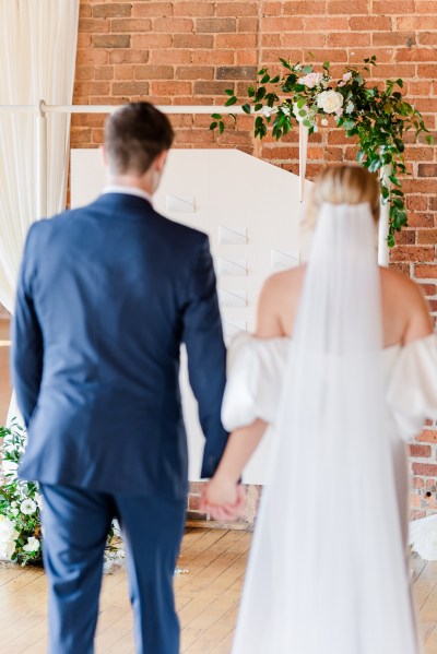 Bride and groom from behind veil detail