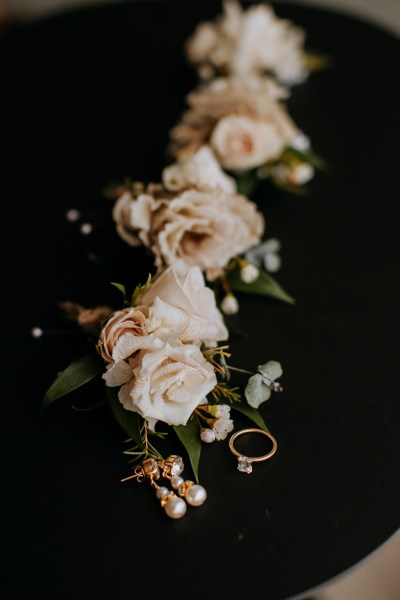 White roses bouquet and diamond ring/pearl earrings