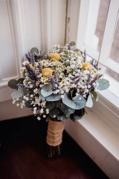 Bridal bouquet leaning against windowsill