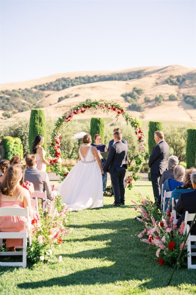 Wide shot view of ceremony bride at alter with groom