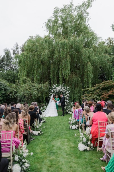 bride groom guests seated and celebrant during wedding ceremony