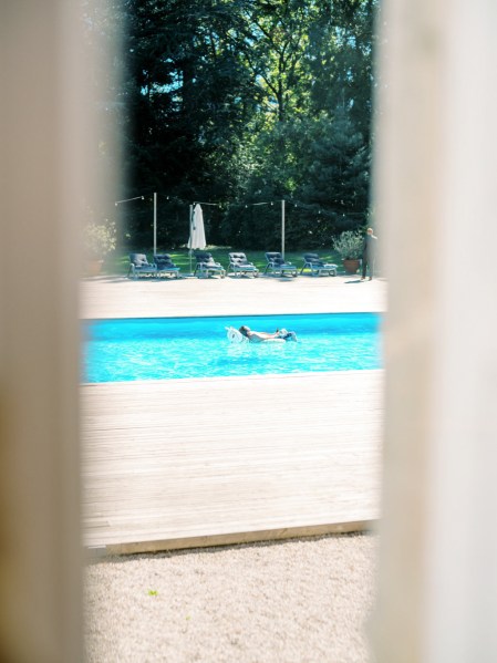 Pool view through window frame