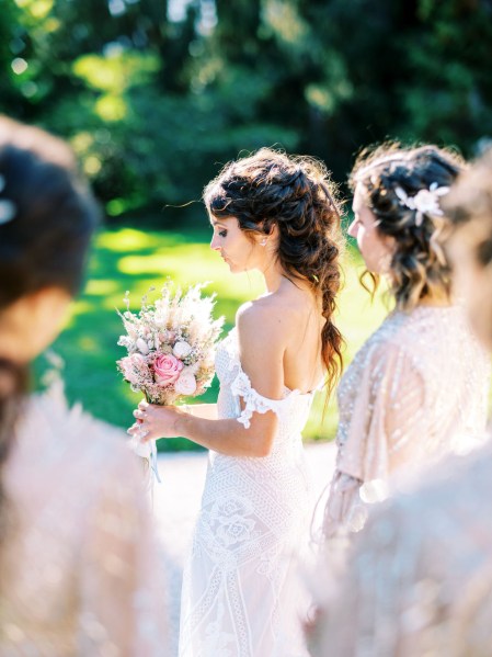 bride looks down and smiles