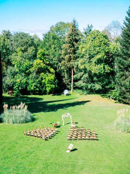 Ceremony setting green grass and forest