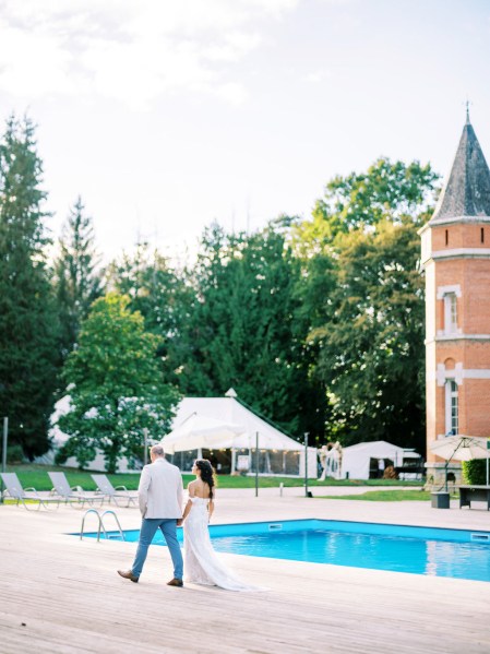 Pool view and wedding venue bride and groom walking