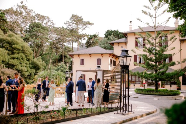 atmosphere shot of guests outside of wedding venue