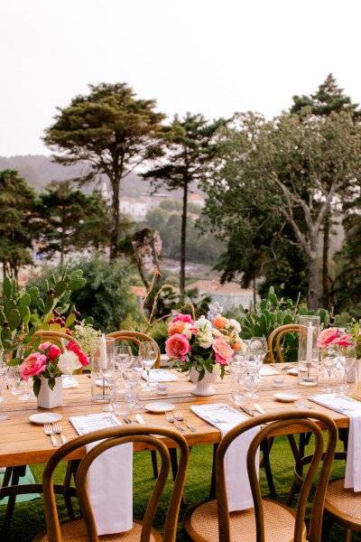 table decor setting exterior wooden cutlery and forest scenery mountains in background