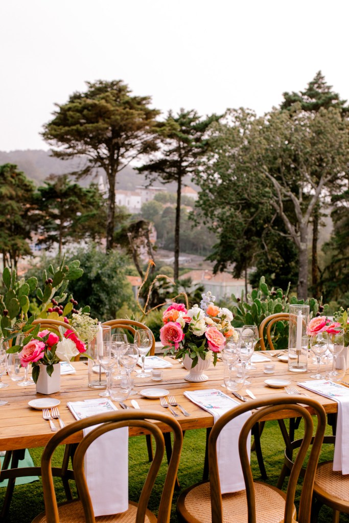 table decor setting exterior wooden cutlery and forest scenery mountains in background