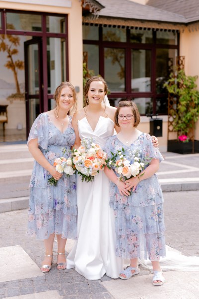 bride in the middle of her bridesmaids