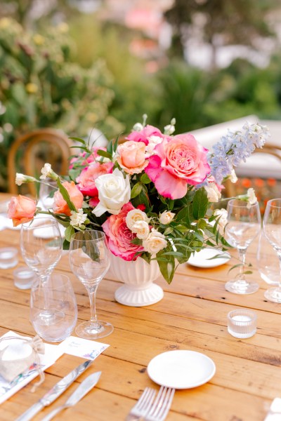 pink decor flowers vase wooden table and glasses