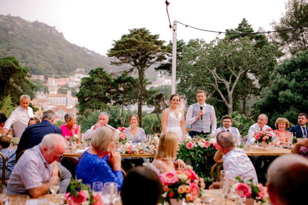 bride and groom give speech to guests