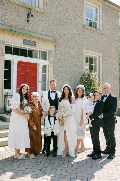 Family pic of bride groom little boy family members and little girl