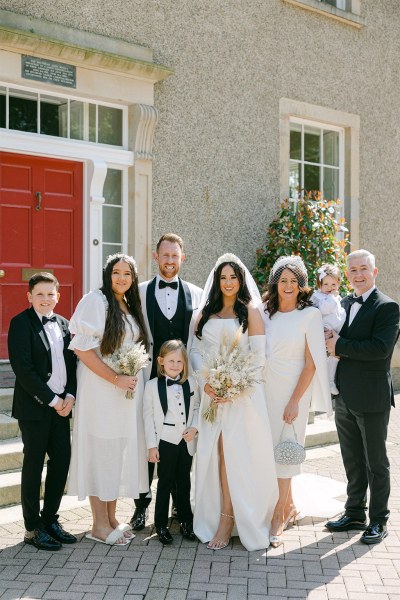 Family pic of bride groom little boy family members and little girl