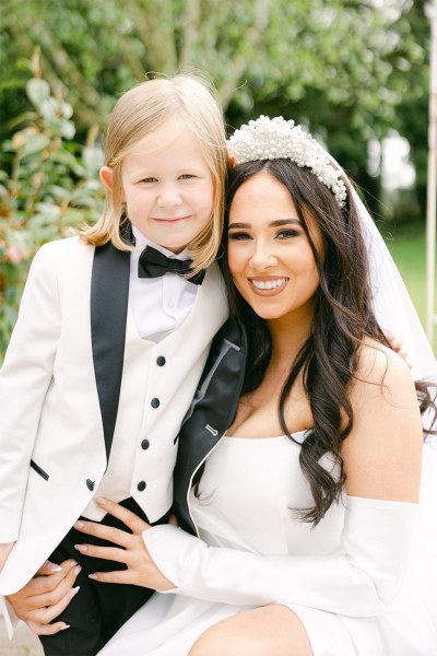 Mother and son in white bowtie jacket suit shirt