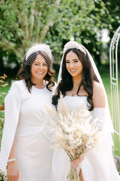 Mother bride and son pose for the camera all smiles