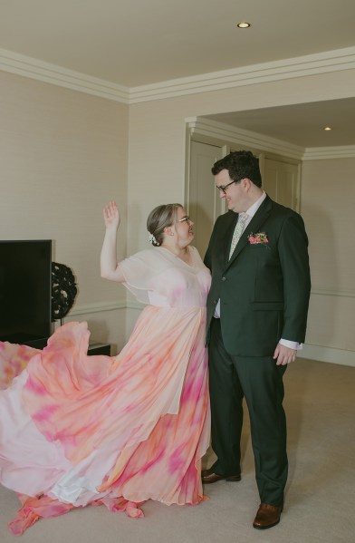 bride and groom stand inside room together