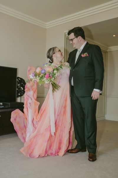 bride and groom stand inside room together