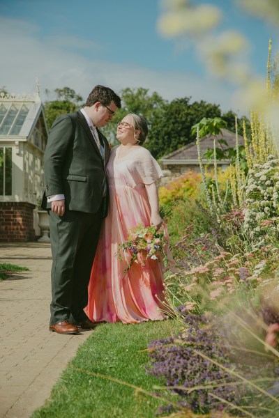 bride and groom in garden setting together