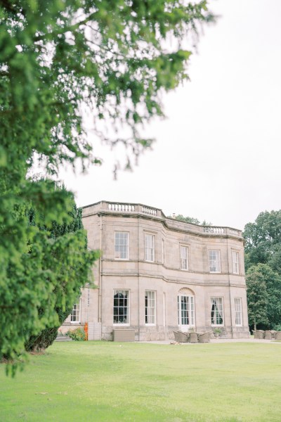 exterior wedding venue green grass setting and trees