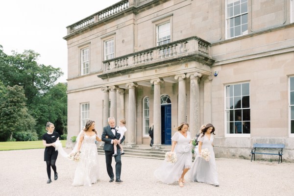 wedding venue courtyard bride groom and family walking