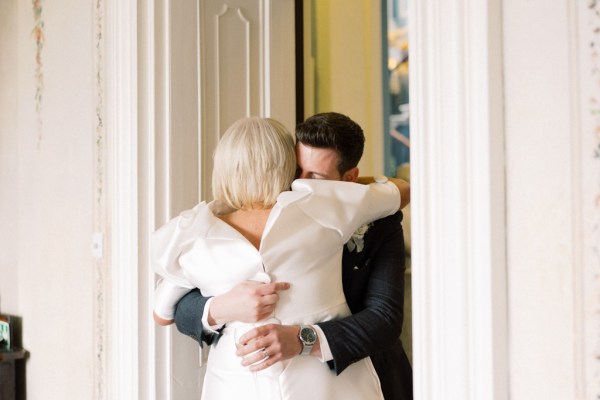 bride hugs her son groom