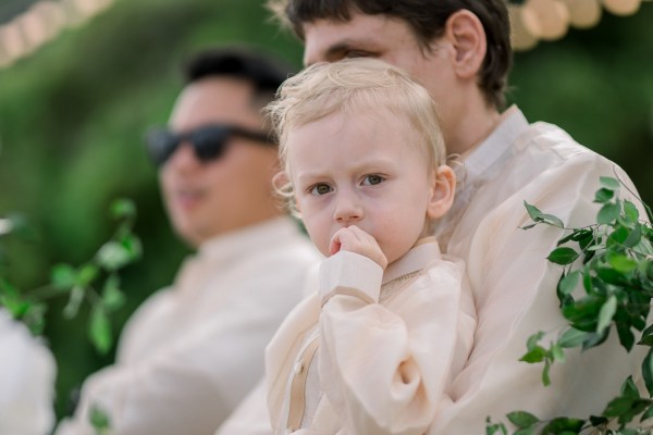 little blonde boy sitting on fathers lap