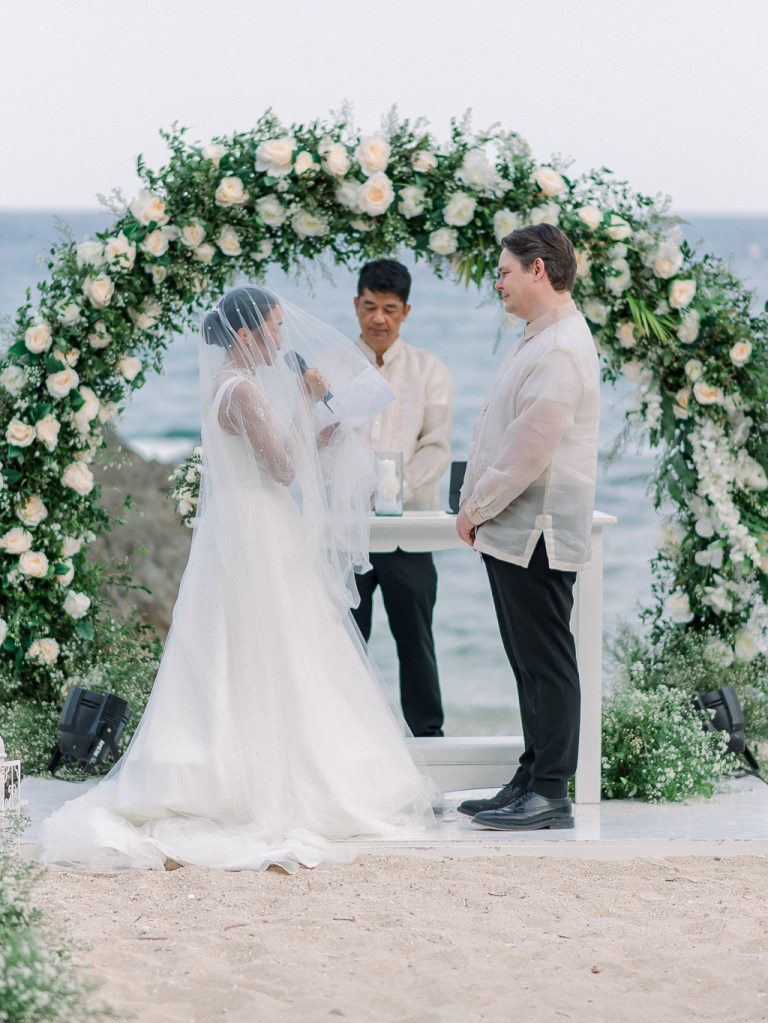 bride groom and celebrant at alter