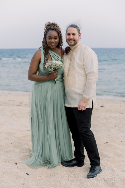 bridesmaid and groomsman pose together