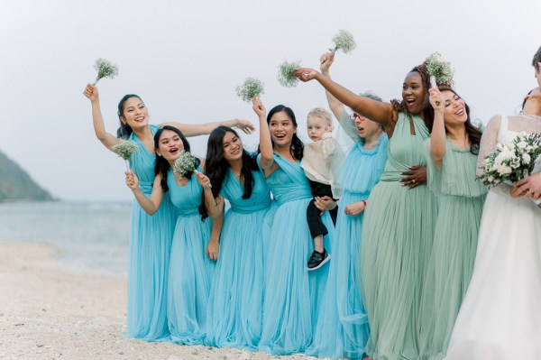 bridesmaids all cheers flowers in the air