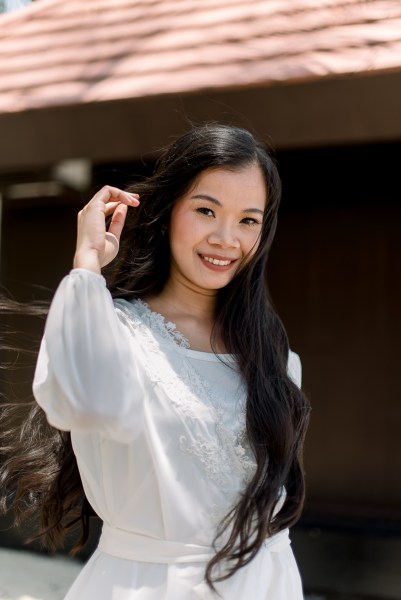 bride hand to her hair all smiles